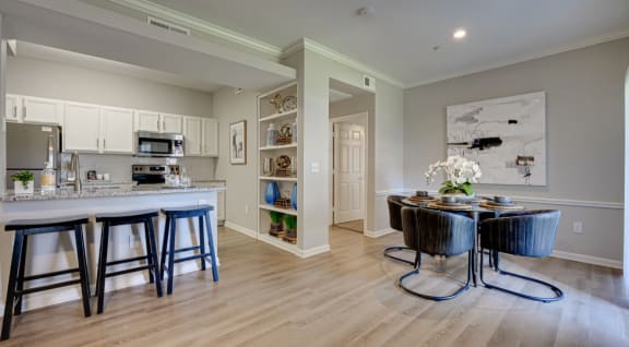 a kitchen and dining room with a table and chairs  at Limestone Ranch, Lewisville