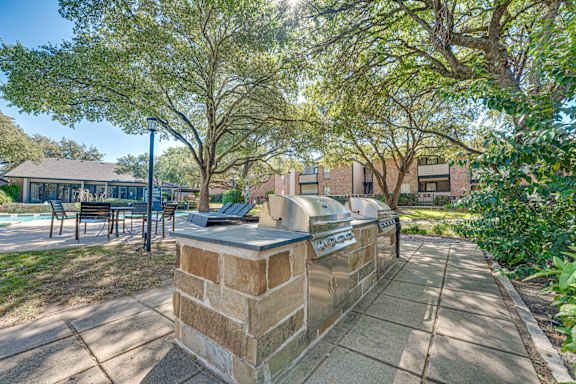 planter on top is in the middle of a paved walkway at Southern Oaks, Fort Worth