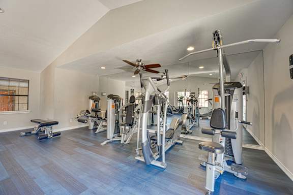 variety of exercise equipment in gym at Timberglen Apartments, Dallas