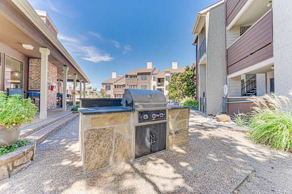 stone fireplace is in the middle at Timberglen Apartments, Dallas, TX 75287