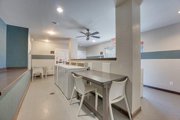 white chairs and grey table at Timberglen Apartments, Dallas, TX