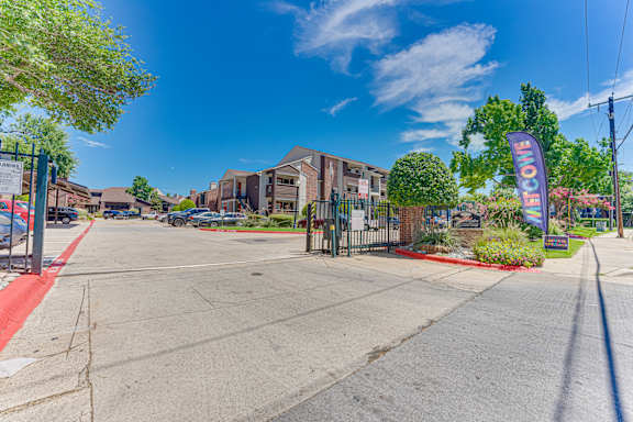 sunny day at the entrance at Timberglen Apartments, Dallas, TX 75287