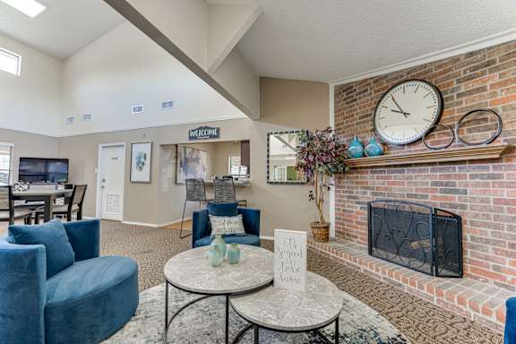 Spacious living room with fireplace and vaulted ceiling at Towne Centre Village Apartments, Mesquite, TX 75150