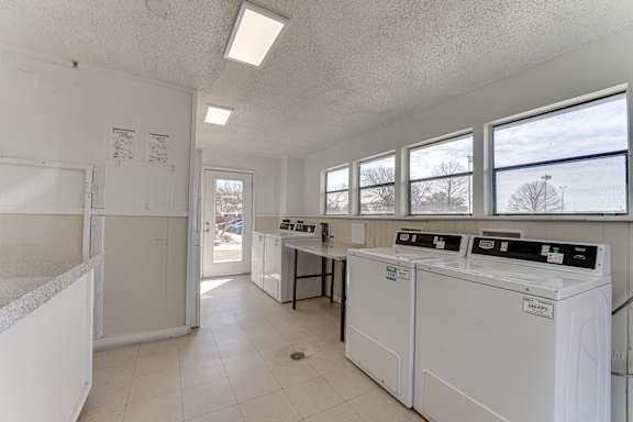 Laundry facility with washers and dryers at Towne Centre Village Apartments, Mesquite, 75150