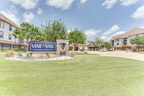 sign for Vine + Vail Townhomes at Vine + Vail Townhomes and Apartments, Grapevine Texas& Apartments