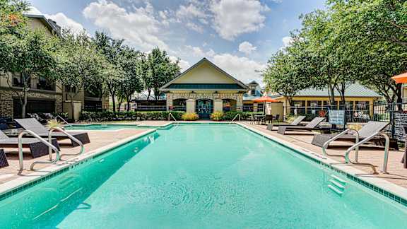 swimming pool with a yellow roof at Wind Dance, Carrollton