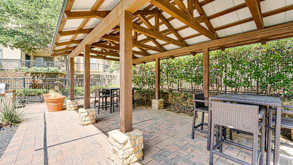 A patio with a table and chairs at Wind Dance, Texas