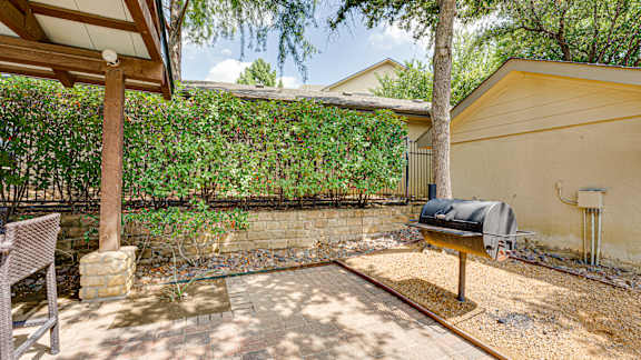 patio with a grill and a table at Wind Dance, Carrollton, TX 75010