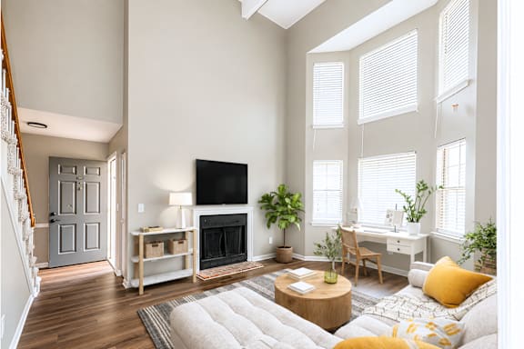 A living room with a fireplace and a couch.