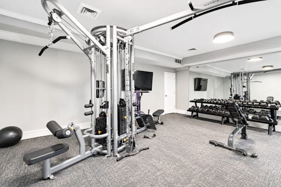 A well-equipped gym with a variety of exercise machines.