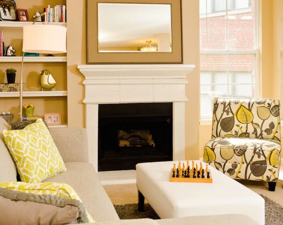 a living room filled with furniture and a fire place