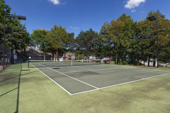 tennis court outside The Magnolia apartment building