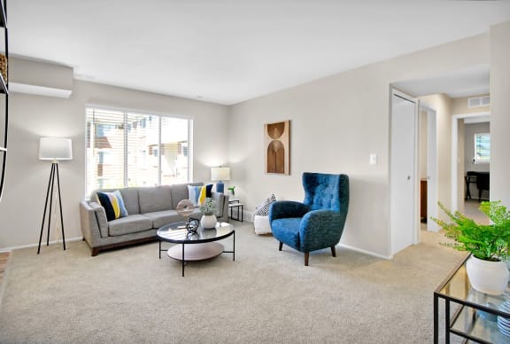 spacious living area of a Romulus apartment at The Maxwell