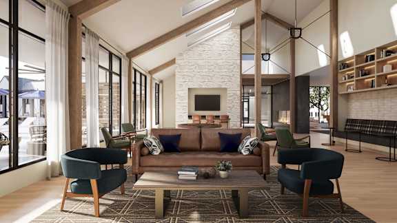 A modern living room with a fireplace and a large window.
