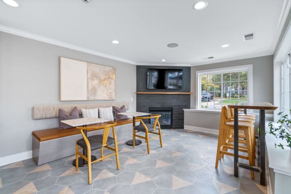 a dining room with a table and chairs and a fireplace