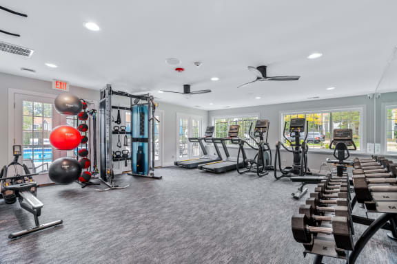 weights and cardio machines in the Windbrooke Crossing Apartments fitness center