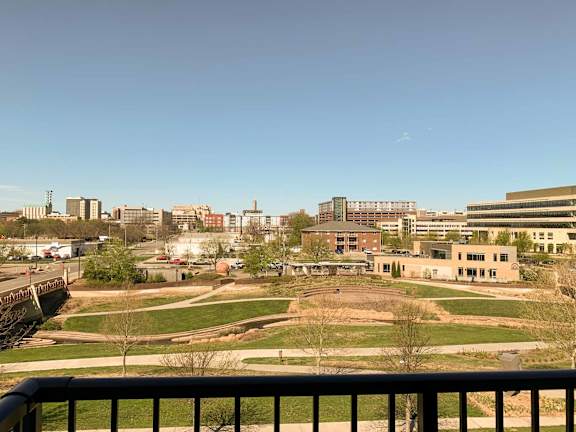a view of a nearby park from the balcony