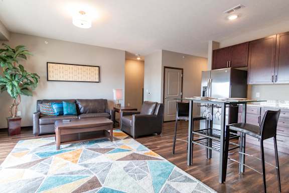 Living room and kitchen space at 360 at Jordan West