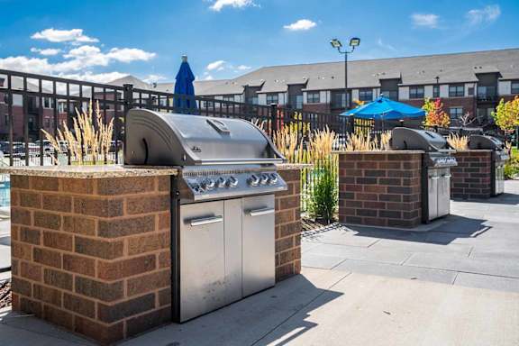 multiple brick grilling stations with gas stainless-steel grills