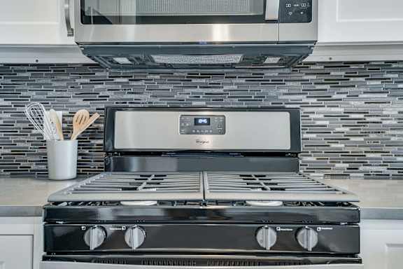premium white finish style appliances and backsplash