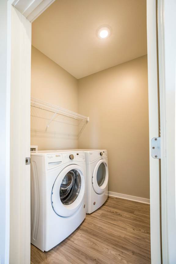 A laundry room with a washer and dryer.