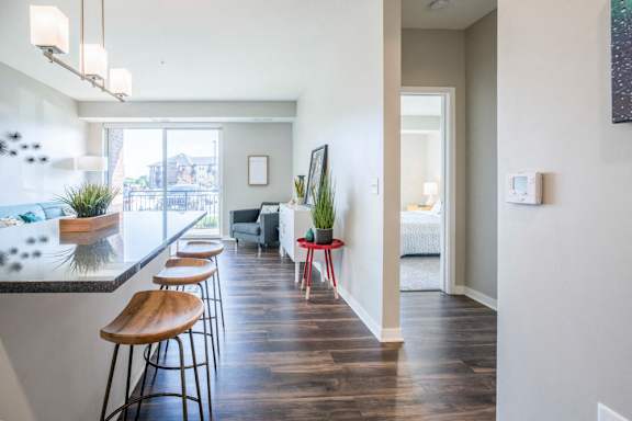 Open layout with view of living room from kitchen at Ascend at Woodbury new luxury apartments in Woodbury MN 55129