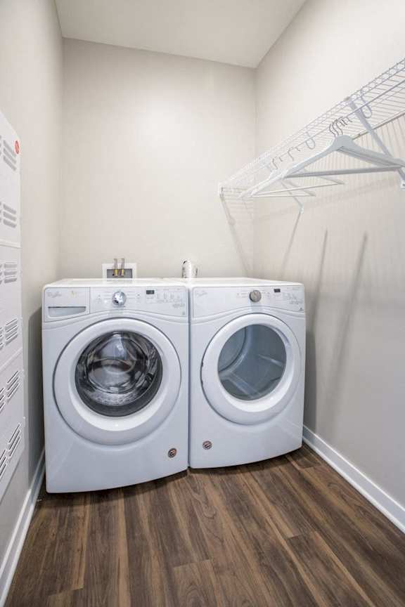 Front loading washer and dryer in a laundry room
