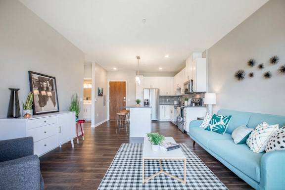 Open floor plan with hardwood floors and white cabinetry at Ascend at Woodbury MN 55129 new luxury apartments