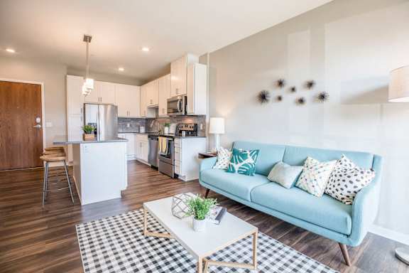 Alpine design scheme with white cabinetry and granite counters at Ascend at Woodbury MN 55129 new luxury apartments
