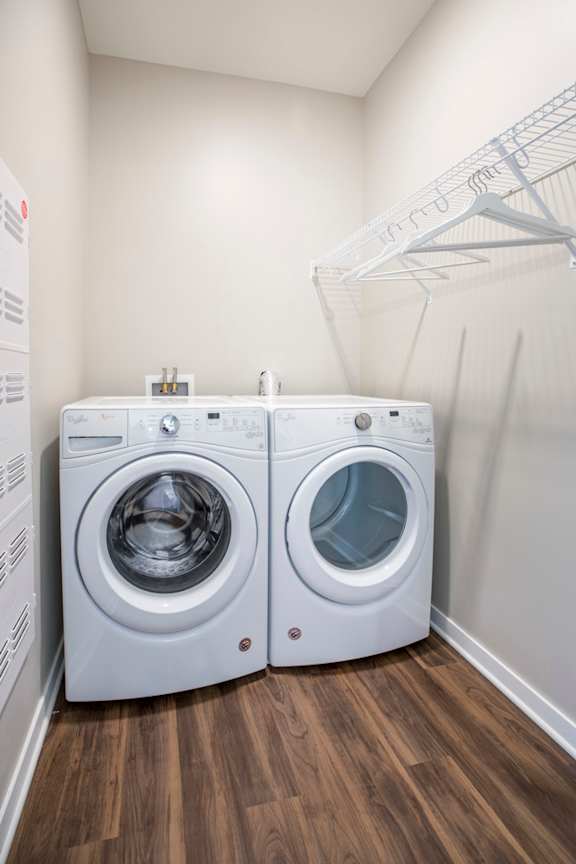 Front loading washer and dryer in a laundry room