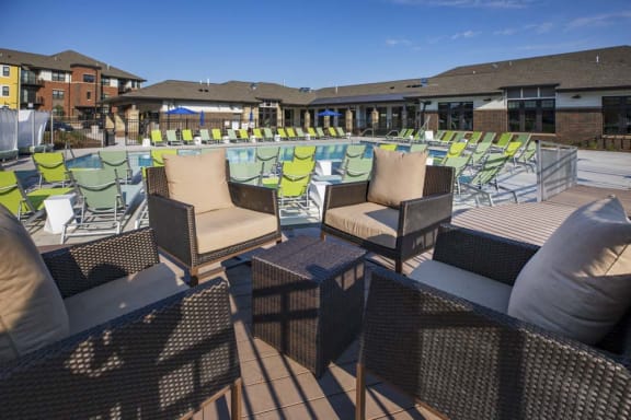 Outdoor seating by pool at Ascend at Woodbury new luxury apartments in Woodbury MN 55129