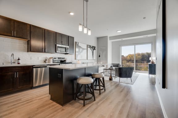 1 bedroom luxury apartment kitchen with dark brown cabinets in Woodbury MN 55125
