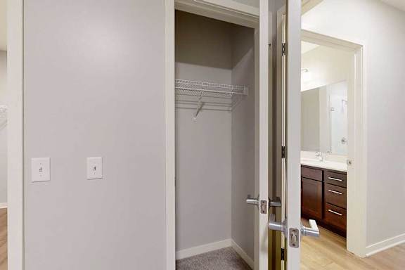 A white door with a mirror on the other side.