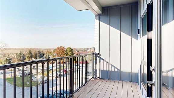 a balcony with a black metal railing