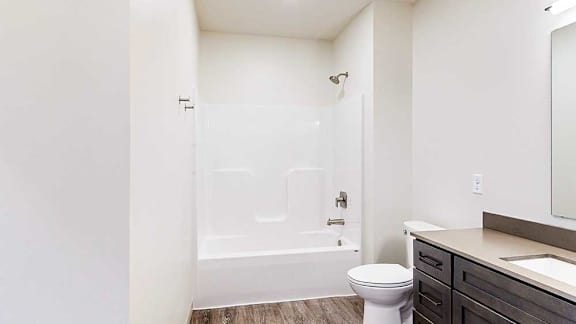 a bathroom with a white shower tub