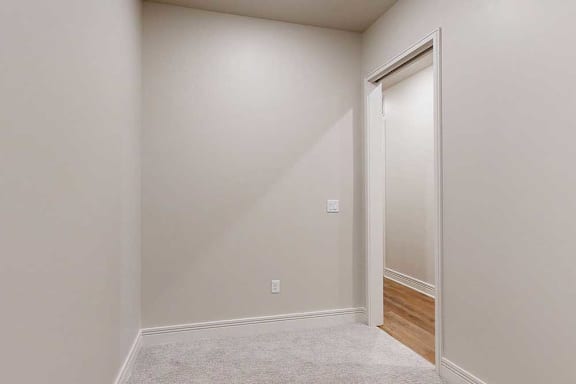 A carpeted den space, perfect for an at home office.