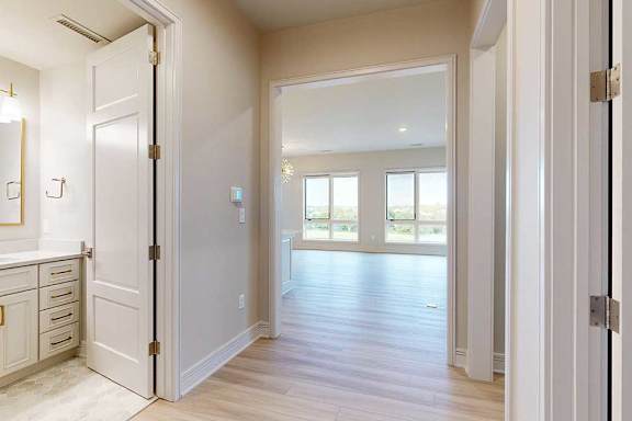 Hallway looking towards the penthouse living room and hall bath to the left