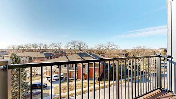 a balcony with a metal railing and a view of the neighboring Villas at Wilderness Ridge