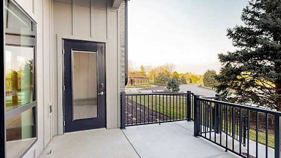 a black windowed door on a walk-out patio