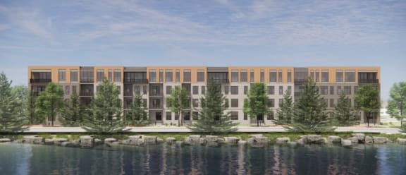 rendering of Brynwood at Wilderness Ridge apartments with trees in front of a body of water