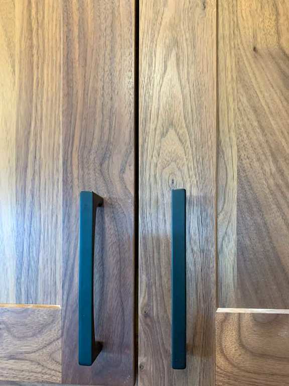 matte black handles on the wooden cabinetry in the kitchen