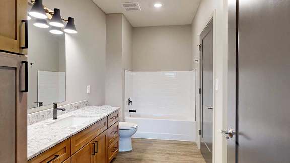 a bathroom with both a walk-in shower and soaking tub