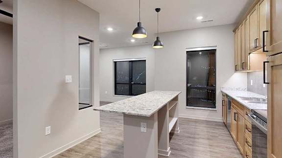 A kitchen with a countertop and cabinets.