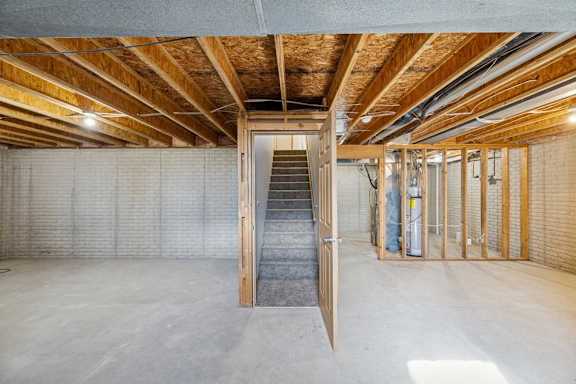 A room with a wooden ceiling and a concrete floor.
