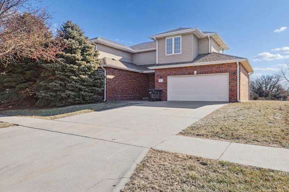 A house with a garage and a driveway.