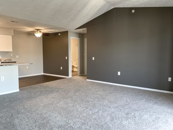 Spacious living room and dining room in the renovated style at Eagle Run Apartments in Omaha Nebraska