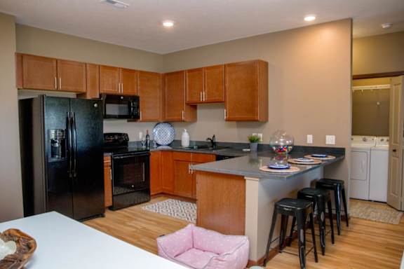 U-shaped kitchen with black appliances