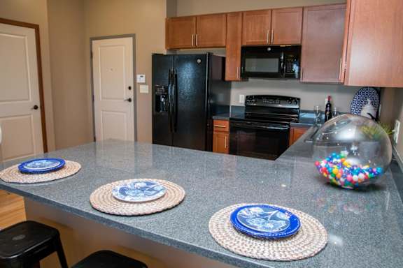 Kitchen with peninsula counter and bar stools