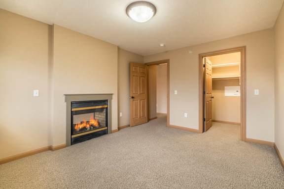 an empty bedroom with a fireplace