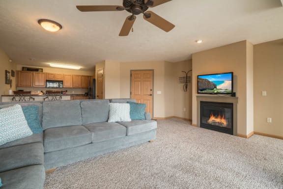 a living room with a couch and a fireplace